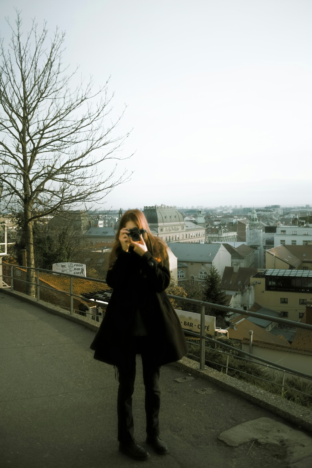 Portrait of a Croatian male mystery novelist in his forties wearing a dark coat